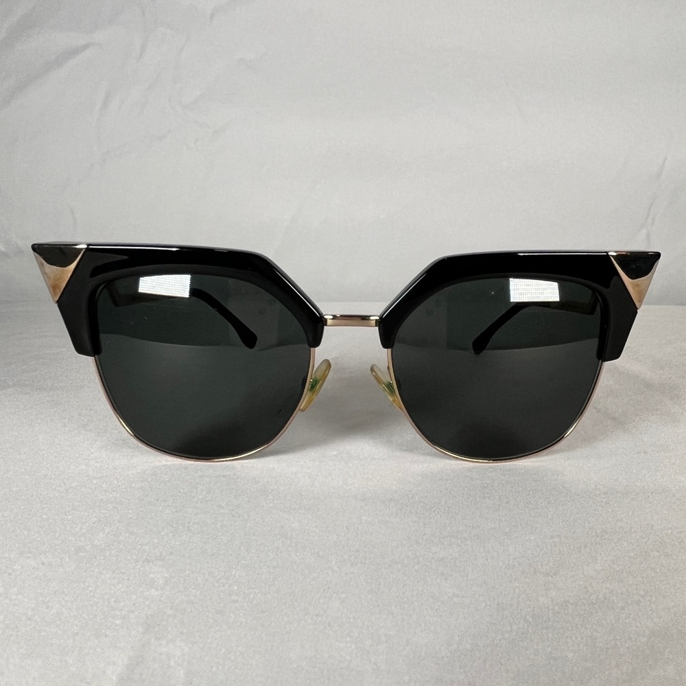 Fendi cat eye black and gold sunglasses.